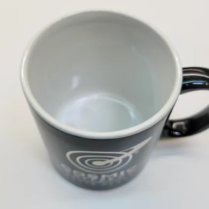 Cosmic Coffee Logo Mug. White interior 11 ounce black mug with metallic silver logo. Dishwasher safe.