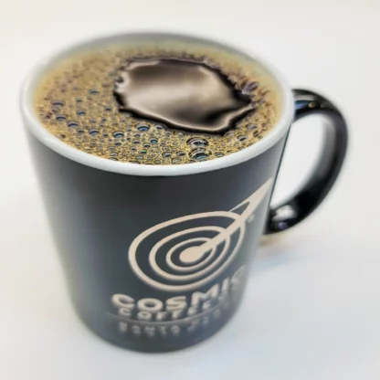 Cosmic Coffee Logo Mug. Black 11 ounce mug with screen printed metallic silver logo. Dishwasher safe. Fill it with your favorite Cosmic Coffee!